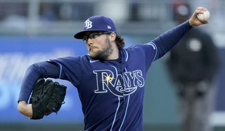 Tampa Bay Rays starting pitcher Josh Fleming throws during the first inning of a baseball game against the Kansas City Royals, Monday, April 19, 2021, in Kansas City, Mo. (AP Photo/Charlie Riedel)