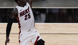 Miami Heat guard Kendrick Nunn (25) drives to the basket during the second half of an NBA basketball game against the Houston Rockets, Monday, April 19, 2021, in Miami. The Heat defeated the Rockets 113-91. (AP Photo/Marta Lavandier)