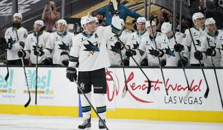 San Jose Sharks center Patrick Marleau (12) waves to the crowd during a small ceremony to mark his passing Gordie Howe for most NHL games played in the first period of an NHL hockey game Monday, April 19, 2021, in Las Vegas. (AP Photo/John Locher)