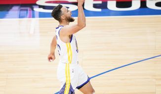 Golden State Warriors&#39; Stephen Curry reacts after making a three-pointer during the second half of an NBA basketball game against the Philadelphia 76ers, Monday, April 19, 2021, in Philadelphia. (AP Photo/Matt Slocum)