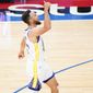 Golden State Warriors&#39; Stephen Curry reacts after making a three-pointer during the second half of an NBA basketball game against the Philadelphia 76ers, Monday, April 19, 2021, in Philadelphia. (AP Photo/Matt Slocum)