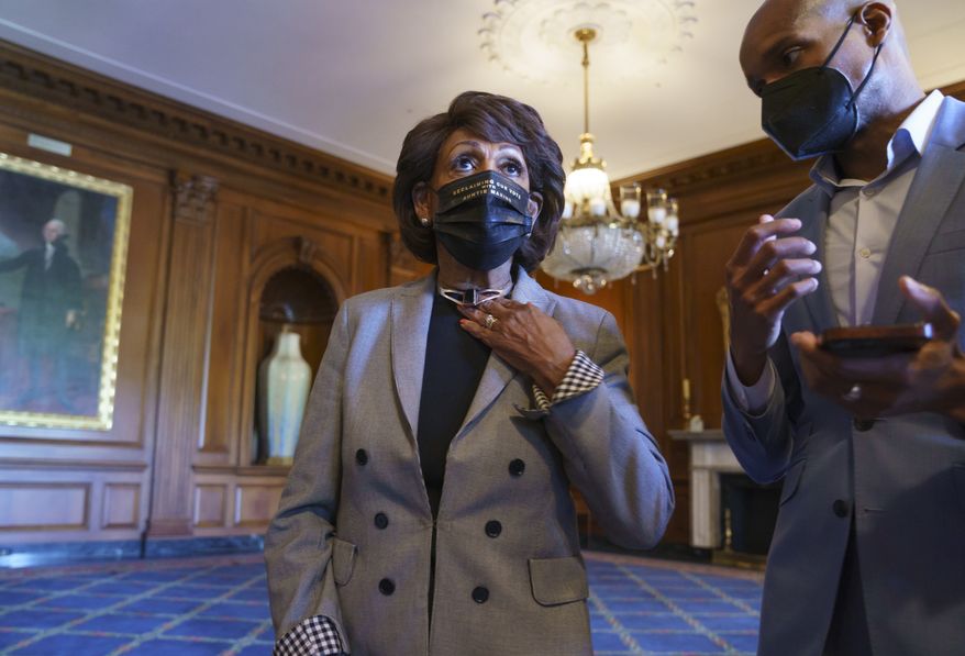 Rep. Maxine Waters, D-Calif., listens to an aide as she joins members of the Congressional Black Caucus to await the verdict in the murder trial of former Minneapolis police Officer Derek Chauvin in the death of George Floyd, on Capitol Hill in Washington, Tuesday, April 20, 2021. (AP Photo/J. Scott Applewhite)
