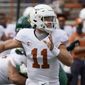 In this Oct. 24, 2020, file photo, Texas&#39; Sam Ehlinger looks to pass against Baylor during the first half of an NCAA college football game in Austin, Texas. Who would make a college football Super League? Think big-brand schools with large fanbases and a history of success ... such as Texas. (AP Photo/Chuck Burton, File) **FILE**