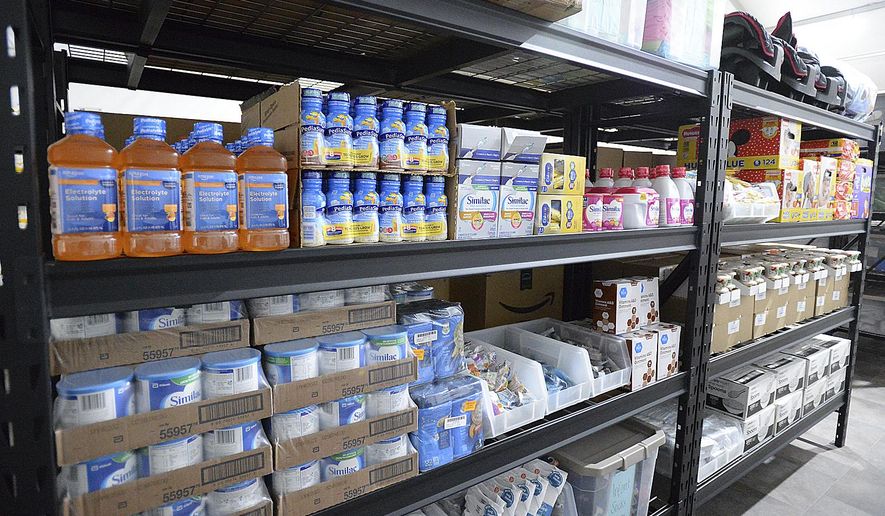 Shelves inside a storage room are stocked with items for infants during an open house at the U.S. Border Patrol Yuma Sector processing facility Tuesday, April 20, 20201, in Yuma, Ariz. (Randy Hoeft/The Yuma Sun via AP)
