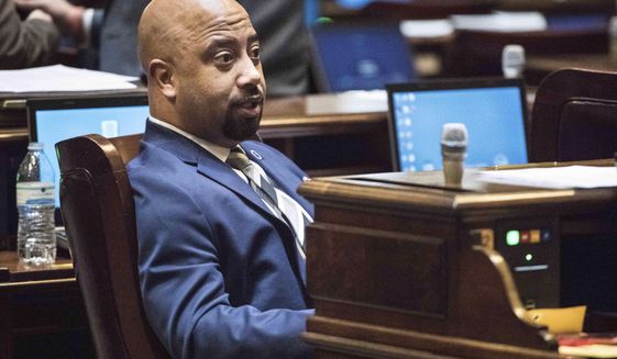 Rep. Cezar McKnight sits at a desk in the House chamber at the South Carolina Statehouse Tuesday, Jan. 10, 2017, in Columbia, S.C. A House committee Tuesday, April 20, 2021 approved a bill that would add South Carolina to a list of states calling for a convention to propose amendments to the U.S. Constitution. Rep. McKnight said as a Black man, he could not approve of a process that could “change the very fabric of the united states of America.” (AP Photo/Sean Rayford, file)