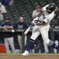 Seattle Mariners&#39; Taylor Trammell hits an RBI-double to score Luis Torrens during the fourth inning of a baseball game against the Los Angeles Dodgers, Monday, April 19, 2021, in Seattle. (AP Photo/Ted S. Warren)