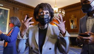Rep. Maxine Waters, D-Calif., talks on Capitol Hill in Washington on Tuesday, April 20, 2021, as she waits for the verdict to be read in the murder trial of former Minneapolis police Officer Derek Chauvin in the death of George Floyd. (AP Photo/J. Scott Applewhite)