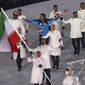 FILE - Samaneh Beyrami Baher carries the flag of Iran during the opening ceremony of the 2018 Winter Olympics in Pyeongchang, South Korea, in this Friday, Feb. 9, 2018, file photo. A group of athletes and human rights activists is calling on the IOC to sanction Iran&#39;s Olympic program for what it says is the country&#39;s long-running pattern of ordering athletes to avoid competing against Israelis in international events.  (AP Photo/Michael Sohn, File)