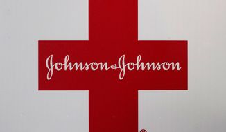 A Johnson &amp;amp; Johnson logo appears on the exterior of a first aid kit, Wednesday, Feb. 24, 2021, in Walpole, Mass. Johnson &amp;amp; Johnson (JNJ) on Tuesday, April 20 reported first-quarter net income of $6.2 billion. (AP Photo/Steven Senne)