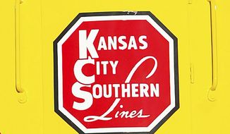 FILE - In this Nov. 5, 2004 file photo, the logo of Kansas City Southern is down on a restored 1954 Kansas City Southern passenger locomotive at Union Station in Kansas City, Mo.  A bidding war is breaking out for Kansas City Southern, with Canadian National Railway making a $33.7 billion cash-and-stock offer for the railway. The bid trumps a $25 billion cash-and-stock proposal made by Canadian Pacific last month. Shares of Kansas City Southern jumped more than 18% in Tuesday, April 20, 2021 premarket trading.(Norman Ng/The Kansas City Star via AP)