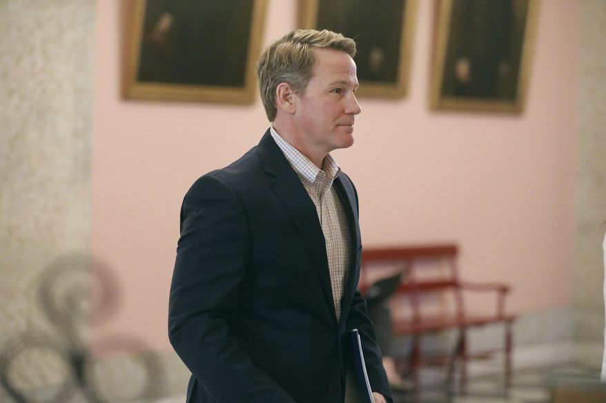 Ohio Lt. Gov. Jon Husted walks out of a news conference on Monday, March 23 2020 at the Ohio Statehouse in Columbus, Ohio. Ohio's lieutenant governor promised a group of Asian American neighbors during a weekend meeting that he would use his public platform to speak out against unwarranted violence facing their community, but he failed to apologize for the divisive tweet that prompted their concern. (Doral Chenoweth/The Columbus Dispatch via AP)