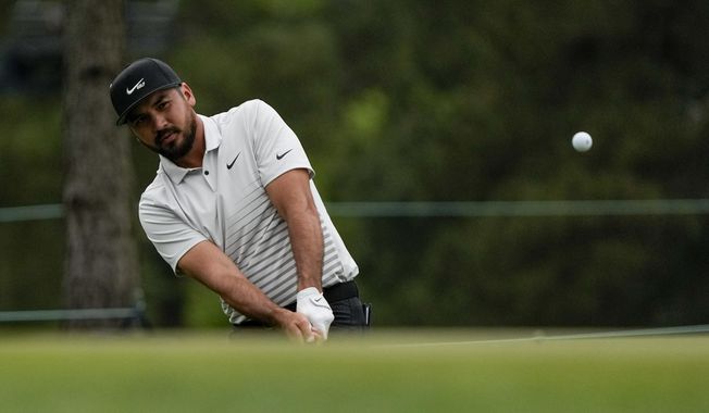 Jason Day, of Australia, chips to the green on the 17th hole during the second round of the Masters golf tournament on Friday, April 9, 2021, in Augusta, Ga. (AP Photo/Gregory Bull)