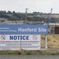 FILE - In this July 9, 2014 file photo, a sign informs visitors of prohibited items on the Hanford Site near Richland, Wash. The U.S. Department of Energy has confirmed that two underground structures at the decommissioned Hanford nuclear reservation in Washington state have been stabilized after they were deemed at risk of collapsing and spreading radioactive contamination into the air. (AP Photo/Ted S. Warren, File)