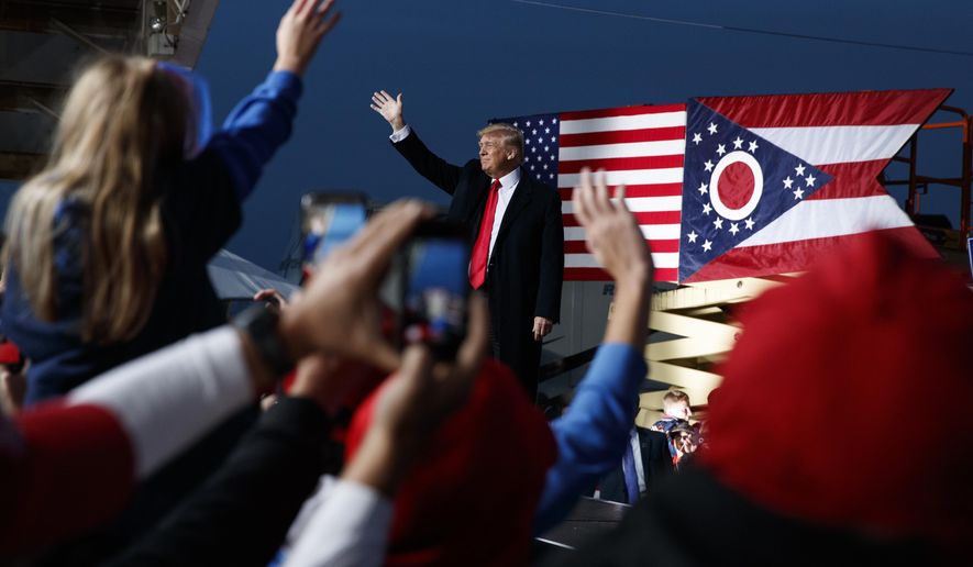 FILE- In this Oct. 12, 2018 file photo then President Donald Trump waves as he arrives for a campaign rally, in Lebanon, Ohio. A GOP-backed bill introduced Monday, April 20, 2021, would change the name of a state park to honor Trump. The House bill primarily sponsored by freshmen Rep. Mike Loychik to rename Mosquito State Park to Donald J. Trump State Park is the latest attempt by Ohio Republicans to honor the former president. (AP Photo/Evan Vucci, File)
