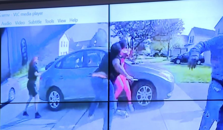 In an image from police bodycam video that the Columbus Police Department played during a news conference Tuesday night, April 20, 2021, a teenage girl, foreground, appears to wield a knife during an altercation before being shot by a police officer Tuesday, April 20, 2021, in Columbus, Ohio. Police shot and the girl just as the verdict was being announced in the trial for the killing of George Floyd. (Columbus Police Department via WSYX-TV via AP)