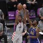 Washington Wizards guard Bradley Beal (3) shoots next to Golden State Warriors forward Andrew Wiggins (22) during the first half of an NBA basketball game, Wednesday, April 21, 2021, in Washington. (AP Photo/Nick Wass)