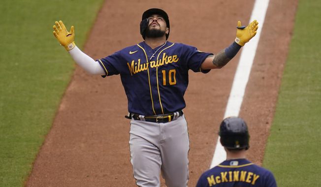 Milwaukee Brewers&#x27; Omar Narvaez looks up as he nears the plate on his two-run home run during the sixth inning of the team&#x27;s baseball game against the San Diego Padres, Wednesday, April 21, 2021, in San Diego. (AP Photo/Gregory Bull)
