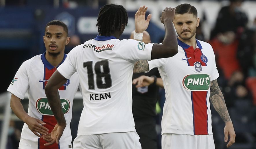 PSG&#39;s Mauro Icardi, right, celebrates with PSG&#39;s Moise Kean after scoring his side&#39;s fifth goal during the French Cup quarter final soccer match between Paris Saint-Germain and Angers SCO at the Parc des Princes stadium in Paris, France, Wednesday, April 21, 2021. (AP Photo/Lewis Joly)