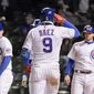 Chicago Cubs Javier Baez (9) celebrates his grand slam home run against the New York Mets during the sixth inning of a baseball game Wednesday, April 21, 2021, in Chicago. (AP Photo/Mark Black)