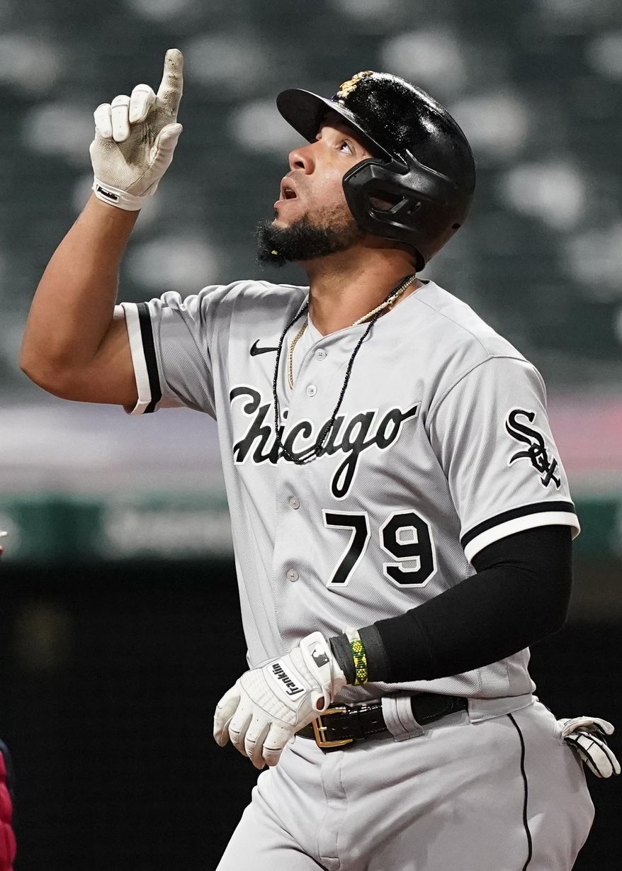 Chicago White Sox's Jose Abreu looks up after hitting a solo home run in the seventh inning in a baseball game against the Cleveland Indians, Tuesday, April 20, 2021, in Cleveland. (AP Photo/Tony Dejak)