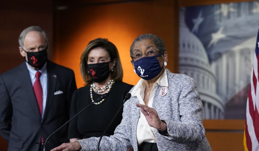 In this April 21, 2021, photo, Del. Eleanor Holmes-Norton, D-D.C., center, joined from left by Sen. Tom Carper, D-Del., and House Speaker Nancy Pelosi, D-Calif., speaks at a news conference ahead of the House vote on H.R. 51- the Washington, D.C. Admission Act, on Capitol Hill in Washington (AP Photo/J. Scott Applewhite)