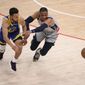 Washington Wizards guard Russell Westbrook (4) and Golden State Warriors guard Stephen Curry (30) chase a loose ball during the first half of an NBA basketball game, Wednesday, April 21, 2021, in Washington. (AP Photo/Nick Wass)