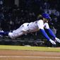 Chicago Cubs&#39; Jake Marisnick (6) dives into third base with a triple against the New York Mets during the eighth inning of a baseball game, Thursday, April, 22, 2021, in Chicago. (AP Photo/David Banks)