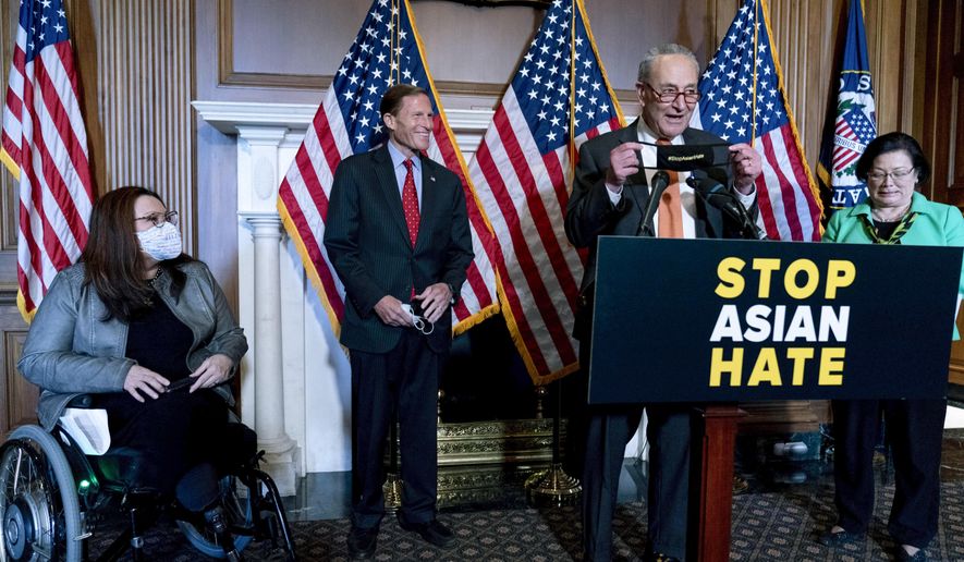 Senate Majority Leader Chuck Schumer of N.Y., accompanied by Sen. Mazie Hirono, D-Hawaii, Sen. Tammy Duckworth, D-Ill., and Sen. Richard Blumenthal, D-Conn., speaks at a news conference after the Senate passed a COVID-19 Hate Crimes Act on Capitol Hill, Thursday, April 22, 2021, in Washington. (AP Photo/Andrew Harnik)