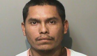 FILE - In this booking photo released by the Polk County, Iowa, Jail, is Marvin Oswaldo Escobar-Orellana. Trial has begun for Escobar-Orellana who is accused of shooting to death a woman and her two young children inside a Des Moines, Iowa, home in 2019. Marvin Esquivel Lopez, who is also known to federal immigration authorities as Marvin Escobar-Orellana, is charged with three counts of first-degree murder and faces life in prison with no possibility of parole if he&#39;s convicted. (Polk County Jail via AP, File)