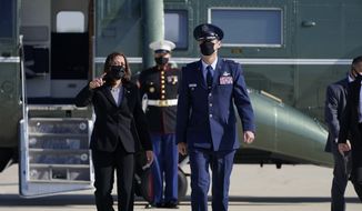 Vice President Kamala Harris talks with Lt. Col. Neil Senkowski, Director of the 89th Airlift Wing Flightline Protocol, as she arrives to board Air Force Two, Friday, April 23, 2021, at Andrews Air Force Base, Md., en route to New Hampshire. (AP Photo/Jacquelyn Martin)