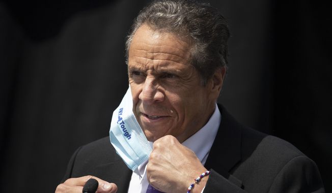 FILE - In this June 15, 2020, file photo, New York Gov. Andrew Cuomo removes a mask as he holds a news conference in Tarrytown, N.Y. Cuomo&#x27;s office said it won&#x27;t reveal what it told the U.S. Justice Department about COVID-19 outbreaks in nursing homes, partly because doing so would be an &amp;quot;invasion of personal privacy.&amp;quot; (AP Photo/Mark Lennihan, File)