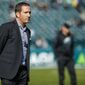 FILE - In this Nov. 3, 2019, file photo, Philadelphia Eagles general manager Howie Roseman stands on the field before the team&#x27;s NFL football game against the Chicago Bears in Philadelphia. The Eagles have drafted so poorly over the past seven years that fans go to baseball games and chant for Roseman to be fired. (AP Photo/Chris Szagola, File)
