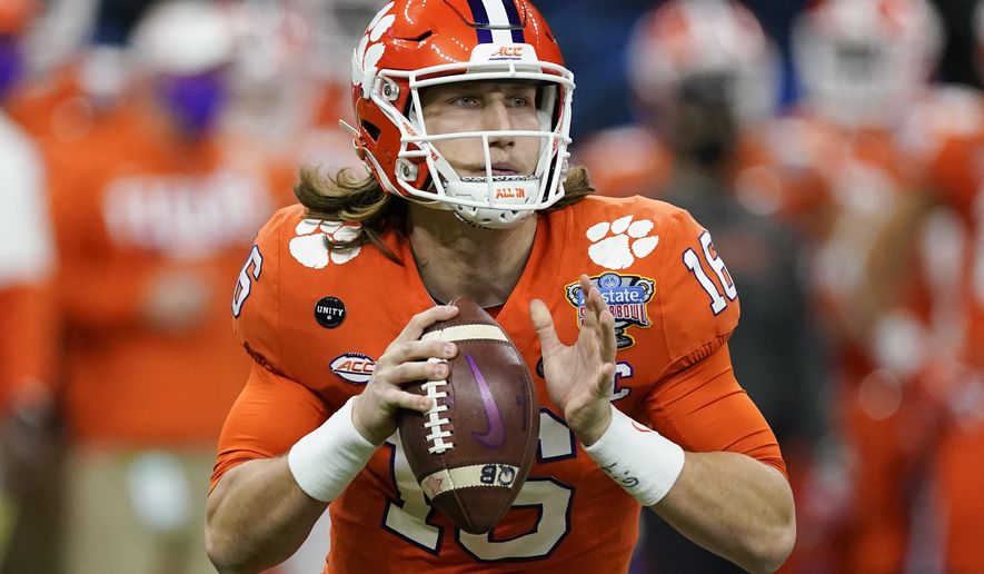 FILE - Clemson quarterback Trevor Lawrence passes against Ohio State during the first half of the Sugar Bowl NCAA college football game in New Orleans, in this Friday, Jan. 1, 2021, file photo. Jacksonville’s draft prospects helped lure Urban Meyer out of coaching retirement. The No. 1 choice, an opportunity to grab Clemson star Trevor Lawrence and secure a franchise quarterback for the foreseeable future. (AP Photo/John Bazemore, File)