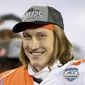 FILE - Clemson quarterback Trevor Lawrence smiles after defeating Notre Dame in the Atlantic Coast Conference championship NCAA college football game in Charlotte, N.C., in this Saturday, Dec. 19, 2020, file photo. Jacksonville’s draft prospects helped lure Urban Meyer out of coaching retirement. The No. 1 choice, an opportunity to grab Clemson star Trevor Lawrence and secure a franchise quarterback for the foreseeable future. (Jeff Siner/The News &amp;amp; Observer via AP, File)