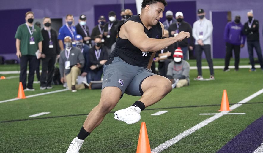 FILE - Northwestern offensive lineman Rashawn Slater, participates in the school&#39;s Pro Day football workout for NFL scouts Tuesday, March 9, 2021, in Evanston, Ill. The acquisition of Sam Darnold via trade earlier this month has given the Carolina Panthers more options with the No. 8 pick in the NFL draft. Carolina&#39;s most pressing need entering the draft is at left tackle, a position they have failed to solidify over the last seven seasons. (AP Photo/Charles Rex Arbogast, File)