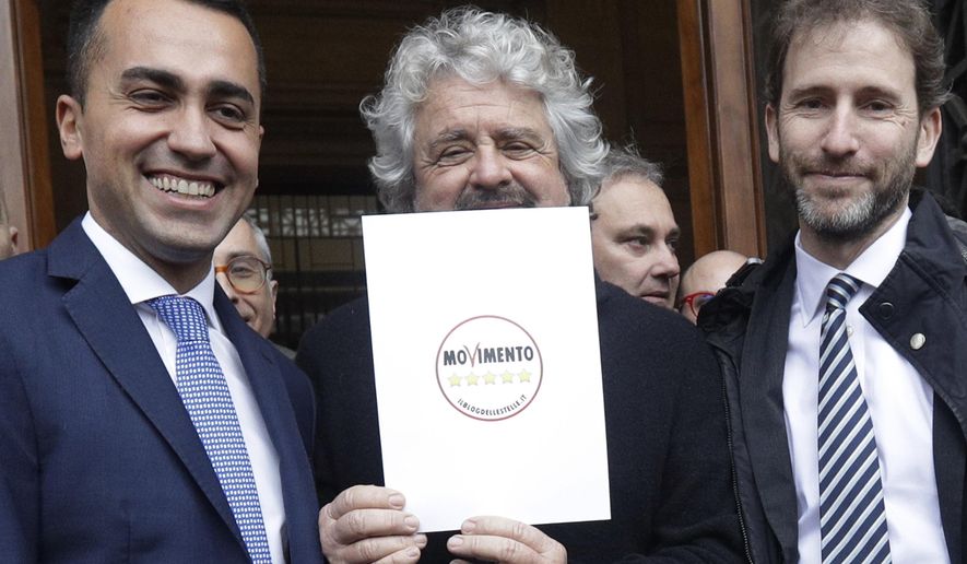 FILE - In this Friday, Jan. 19, 2018 file photo, 5-Star Movement founder Beppe Grillo, center, flanked by movement cofounder Davide Casaleggio, right, and lawmaker Luigi Di Maio pose in Rome. Italy's 5-Star Movement suffered a second blow in a week Friday after it split with Rousseau, the association that runs its "direct democracy" online platform allowing registered members to vote on key policy decisions. Rousseau is headed by Davide Casaleggio, whose father co-founded the 5-Star Movement along with comic Beppe Grillo. (AP Photo/Gregorio Borgia, File)