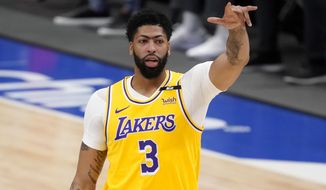 Los Angeles Lakers forward Anthony Davis gestures during the first half of the team&#39;s NBA basketball game against the Dallas Mavericks in Dallas, Thursday, April 22, 2021. (AP Photo/Tony Gutierrez)