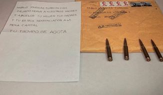 This photo released by the United We Can Party, shows four bullets that arrived inside an envelope addressed to United We Can Party leader Pablo at the Interior Ministry&#x27;s headquarters in Madrid on Friday, April, 23, 2021. Most political parties in Spain have condemned a series of death threats mailed to the country&#x27;s interior minister, the director of the Civil Guard police force and the leader of a far-left political party. The threats were delivered in envelopes filled with bullets and accompanied by anonymous letters either demanding for the three officials to step down from their positions or plainly menacing the recipients and their relatives. The letter reads in Spanish &amp;quot;you have let our parents and grandparents die, your wife, your parents and you are sentenced to death, your time is running out.&amp;quot; (United We Can Party Office Via AP)
