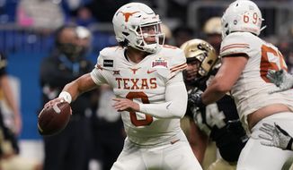 FILE - Texas quarterback Casey Thompson (8) looks to pass during the second half of the Alamo Bowl NCAA college football game against Colorado  in San Antonio, in this Tuesday, Dec. 29, 2020, file photo. Casey Thompson&#39;s Alamo Bowl performance made him look like an easy pick to be starting quarterback at Texas in 2021. But a coaching change from Tom Herman to Steve Sarkisian and the ripe talent of backup Hudson Card has made Saturday&#39;s spring scrimmage, and the months leading into the 2021 season, all about one position and who be the starter against Louisiana on Sept. 4. (AP Photo/Eric Gay, File)