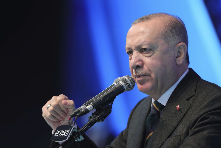 In this March 24, 2021, file photo, Turkey&#39;s President Recep Tayyip Erdogan gestures as he speaks during his ruling party&#39;s congress inside a packed sports hall in Ankara, Turkey. President Joe Biden on April 24, 2021 followed through on a campaign pledge to formally recognize that atrocities committed against the Armenian people by the Ottoman Empire more than a century ago in modern-day Turkey were genocide. This move is likely to strain U.S.-Turkey relations. (Turkish Presidency via AP, File)  **FILE**