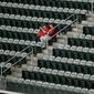 Fans sit in the upper deck seats in Truist Park upon learning a baseball game between the Atlanta Braves and the Arizona Diamondbacks had been postponed on Saturday, April 24, 2021, in Atlanta. The Diamondbacks and Braves will play in a traditional doubleheader Sunday. (AP Photo/Ben Margot) **FILE**