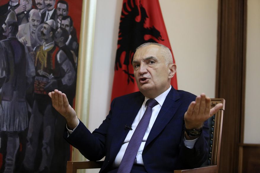 FILE - In this Wednesday, April 21, 2021 file photo, Albanian President Ilir Meta speaks during an interview with the Associated Press in Tirana, Albania.  Albania’s president has accused the U.S. ambassador of intervening in the small European country’s internal affairs by supporting its prime minister in an upcoming parliamentary election. Meta spoke harshly about Ambassador Yuri Kim during a television talk show on Friday, April 23, 2021. While the show was airing, Kim sent a text message to Meta and also tweeted about Sunday’s election. (AP Photo/Hektor Pustina, File)