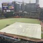 The outfield at Truist Park takes on a white cast during a hail storm prior to a baseball game between the Atlanta Braves and the Arizona Diamondbacks, Saturday, April 24, 2021, in Atlanta. Thunderstorms were were forecast in Atlanta in the early evening. (AP Photo/Ben Margot)