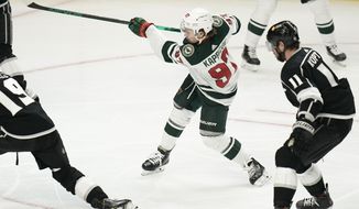 Minnesota Wild&#39;s Kirill Kaprizov, of Russia, shoots to score his second goal of an NHL hockey game during the second period against the Los Angeles Kings Friday, April 23, 2021, in Los Angeles. (AP Photo/Jae C. Hong)