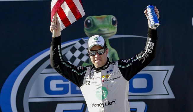 Brad Keselowski (2) celebrates after winning the Geico 500 NASCAR Sprint Cup auto race at Talladega Superspeedway, Sunday, April 25, 2021, in Talladega, Ala. (AP Photo/Butch Dill)