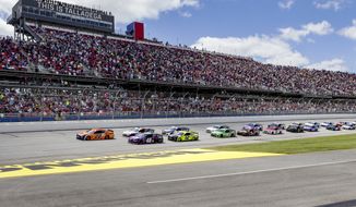 NASCAR Cup Series driver Joey Logano (22) leads the pack to the green flag during the Geico 500 NASCAR Sprint Cup auto race at Talladega Superspeedway Sunday, April 25, 2021 in Talladega, Ala. (AP Photo/Butch Dill)