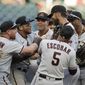 Arizona Diamondbacks pitcher Madison Bumgarner, center right, is congratulated after pitching a seven-inning no-hitter against the Atlanta Braves at the end of the second baseball game of a doubleheader Sunday, April 25, 2021, in Atlanta. (AP Photo/Ben Margot)