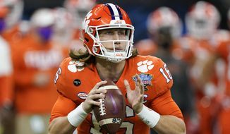 Clemson quarterback Trevor Lawrence passes against Ohio State during the first half of the Sugar Bowl NCAA college football game in New Orleans, Friday, Jan. 1, 2021. About the only certainty in the confounding 2021 NFL draft is Trevor Lawrence going to the Jaguars with the first overall pick Thursday night in Cleveland. This year&#39;s NFL draft is like none other because teams weren&#39;t able to meet face-to-face with the pool of prospects outside the lucky few who got to play in the Senior Bowl after a season that was marked by opt outs and cancellations. (AP Photo/John Bazemore, File) **FILE**