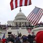 Supporters of President Donald Trump gather outside the U.S. Capitol, Wednesday, Jan. 6, 2021, in Washington. (AP Photo/Shafkat Anowar)
