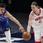 Denver Nuggets forward Michael Porter Jr. (1) and Houston Rockets forward Kelly Olynyk (41) chase the ball during the second half of an NBA basketball game Saturday, April 24, 2021, in Denver. (AP Photo/Jack Dempsey)